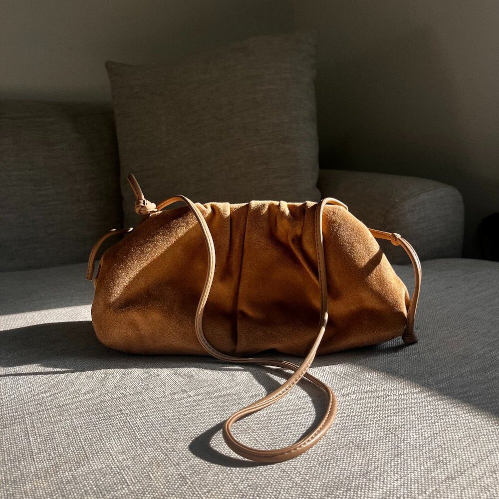 beige crossbody or clutch bag